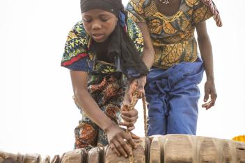 7:48 a.m. — Badariya makes the first of her six trips to the well to fetch water for her family to cook, clean and drink. It’s mostly girls her age and younger who have the job of hauling up the heavy buckets. Without pulleys, the deep grooves worn into the wood over the years provide the only assistance for the backbreaking work.