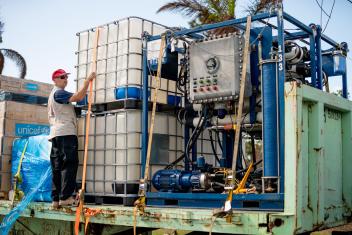 Working with Mission Resolve Foundation, Mercy Corps team members install a reverse osmosis water treatment plant, making saline water safe for cooking, bathing and drinking. Photo: Mission Resolve Foundation