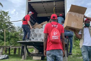 Our team unloads a truck of supplies for distribution in L’Asile. The supply kits include water purification tablets, soap, diapers, mosquito nets, tarps, and more.