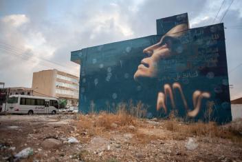 In a celebration of rain a woman embraces falling droplets in this mural by Jonathan Darby. Her face is filled with messages written by the community of Irbid, highlighting the importance and value of this precious resource.