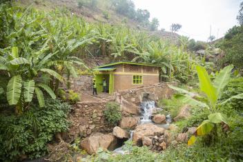 In eastern Rwanda, Energy 4 Impact helped build a mini-grid plant along the Nyankorogoma River that provides electricity to almost 200 households, 14 businesses, and two institutions.