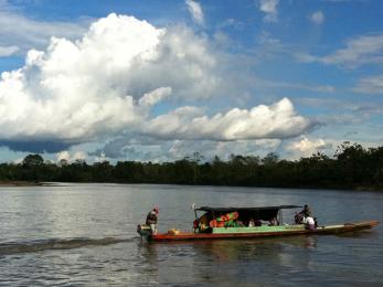 Mercy corps team members and government officials on the way to putamayo, deep in the colombian jungle.