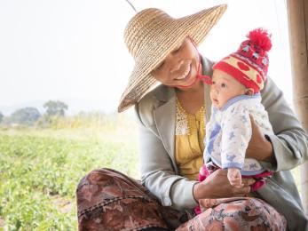 Zar ni lwin, a farmer in myanmar, with her 4-month-old grandson