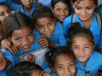 Girls smiling in blue uniforms