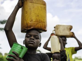 Boys carrying water