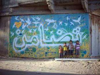 Through an art therapy project, youth in gaza learned how to express themselves and created 11 colorful murals to beautify their communities. photo: samantha robinson/aptart