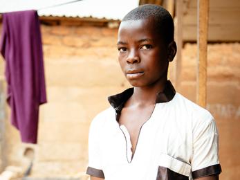 Boy in white shirt with black collar