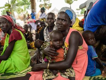 People and children sitting together in south sudan