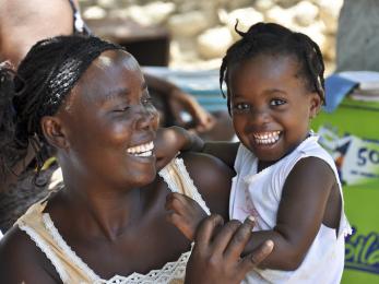 Woman holding a young girl