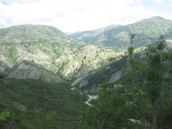 The coastline of ti bwa, with its steep hillsides and rough terrain, is typical of the many haitian mountain towns that suffer from deforestation and erosion. photo: rae lyon/mercy corps