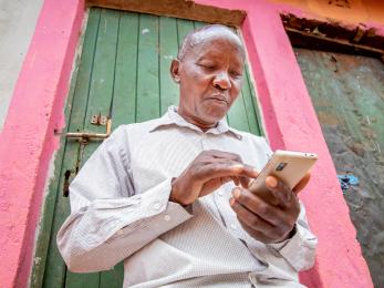 Kenyan man on his smartphone