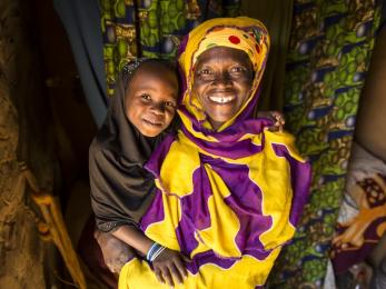 Hawa, a single mother in niger, must find new ways to feed herself, her daughter ramatou and her goats when drought hits. photo: sean sheridan for mercy corps