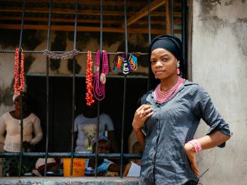 Woman in nigeria by a storefront