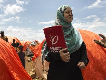 Mercy corps employee in somalia, holding clipboard