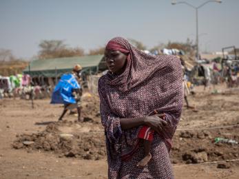 A woman and her child, displaced by the conflict, at one of south sudan's many crowded displacement camps. photo: camille lepage for mercy corps