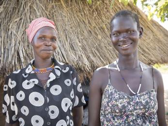 Two women standing next to each other