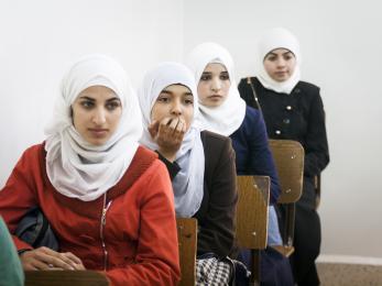 Syrian and jordanian women in a classroom.