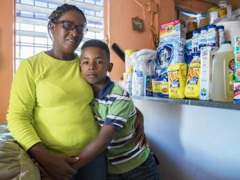 Aide, 45, and her son luis, 12, purchased a variety of urgently needed supplies using their emergency cash card. photo: ezra millstein/mercy corps