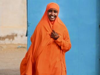 Woman wearing bright orange in somalia