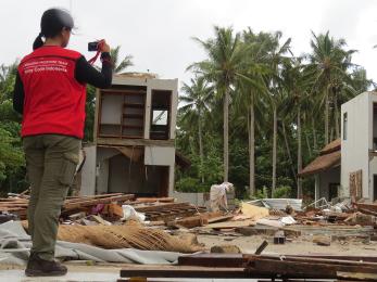 Mercy corps team member taking a photo in indonesia