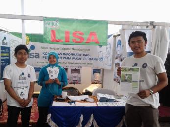 Young people standing at a booth