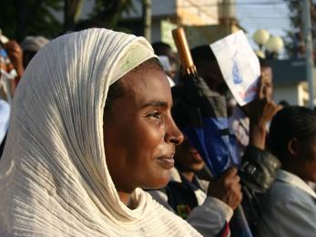 Woman in crowd smiling