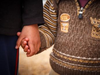 Two people holding hands