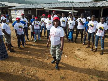 During the 2014 ebola outbreak, community educators for the centre for liberian assistance mobilize in robertsport for a community outreach event on the dangers of ebola. photo: sean sheridan for mercy corps