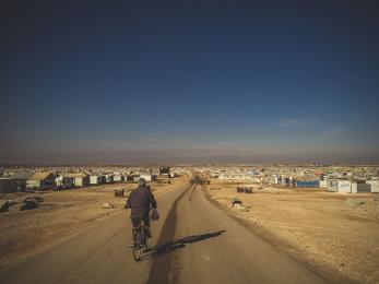 Man biking down road