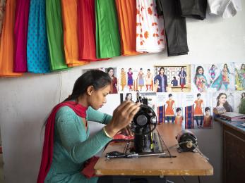 Girl using sewing machine