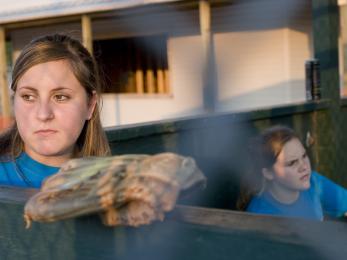 Girls playing softball in the aftermath of katrina in new orleans