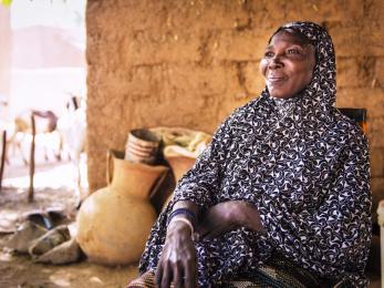 A woman in niger smiling and looking into the distance