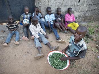 Eight children pictured in nigeria. their caretaker has struggled immensely to feed them with what she can grow and cultivate herself on land she pays to rent. photo: ezra millstein/mercy corps