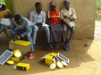 People with unboxed solar energy supplies