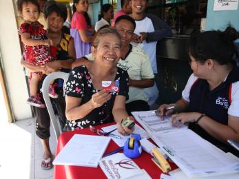 Lady holding a voucher