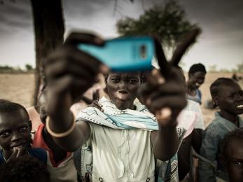 Boy holding mobile phone