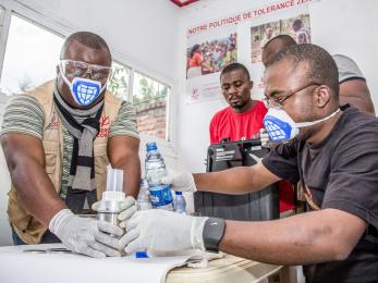 Congolese men working in a laboratory.