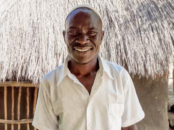 A person smiles for the camera.
