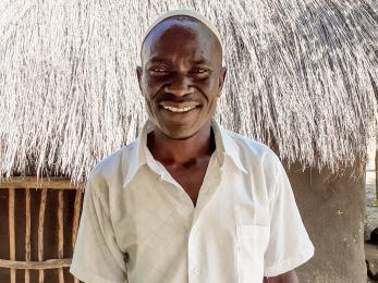 A person smiles for the camera.