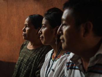 Three people sitting together.