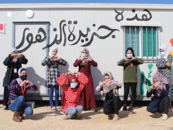 Women in jordan making heart shapes with their hands