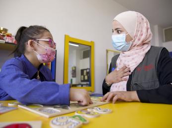 A student and an instructor working together.