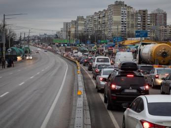 Residents and truck drivers seeking to leave the capital in a traffic jam in kyiv, ukraine. photo credit: erin trieb/bloomberg via getty images