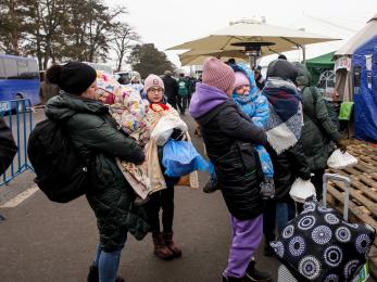 Women and children fleeing ukraine at the romania border.