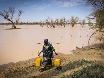 A person collecting water.