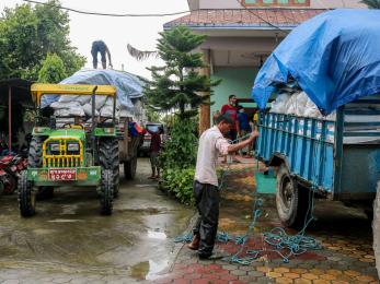 People unloading non-food item kits.