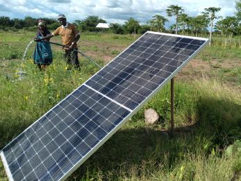 A subsistence farmer using a a solar water pump.