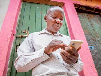 A person using a mobile phone.