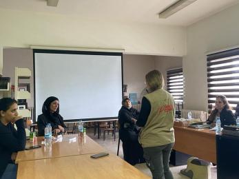 A group of people attending a meeting.