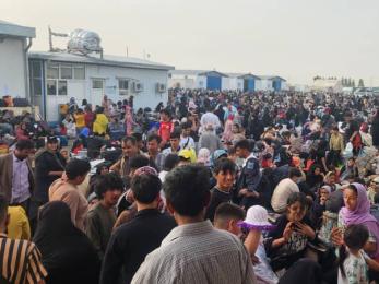 Afghanistan community members assembled in public space.
